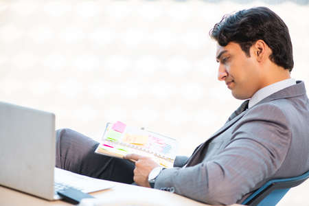 Young successful businessman working at the officeの写真素材