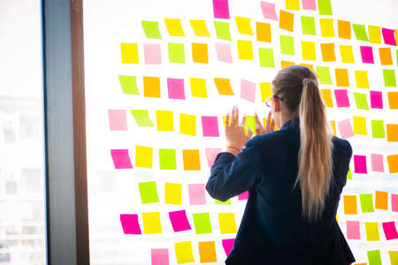 Beautiful female employee with many conflicting priorities
