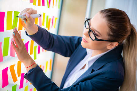 Beautiful female employee with many conflicting priorities