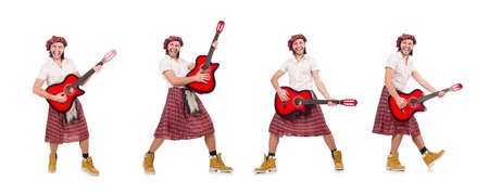Scotsman playing guitar isolated on whiteの写真素材