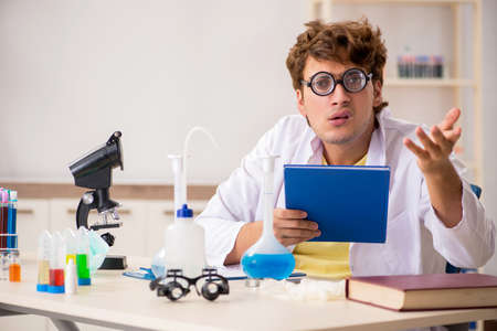 Funny crazy chemist doing experiments and testsの写真素材
