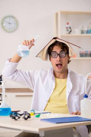 Funny crazy chemist doing experiments and testsの写真素材
