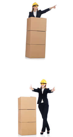 Woman builder with box isolated on whiteの写真素材