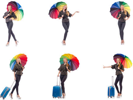 Woman with suitcase and umbrella isolated on whiteの写真素材