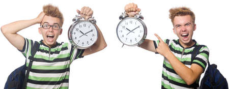 Young student with alarm-clock in time management conceptの写真素材