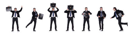 Young businessman holding briefcase isolated on whiteの写真素材