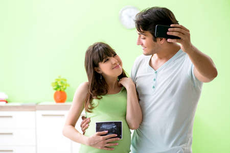 Young family finding out about pregnancyの写真素材