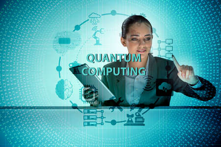 Businesswoman pressing virtual button in quantum computing conceptの写真素材