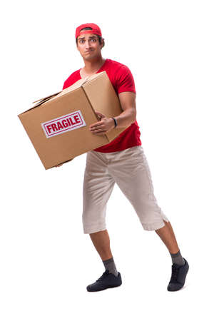 Handsome contractor holding fragile box isolated on whiteの写真素材