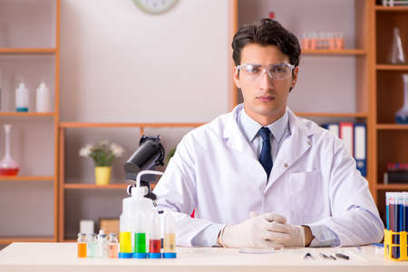 Young biochemist working in the lab
