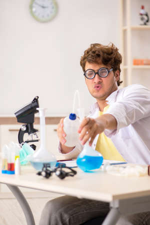Funny crazy chemist doing experiments and testsの写真素材