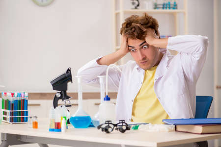Funny crazy chemist doing experiments and testsの写真素材