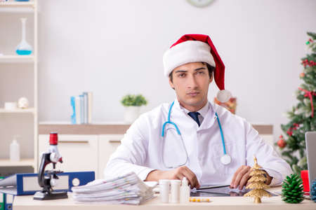 Doctor on the shift on christmas eveの写真素材