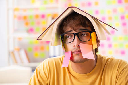 Student preparing for exams with many conflicting prioritiesの写真素材