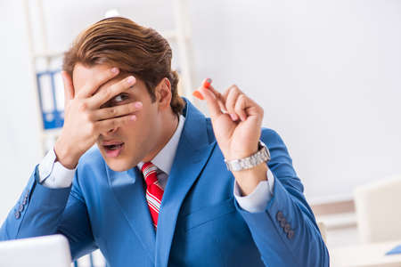 Businessman throwing dart in business conceptの写真素材