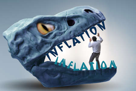 Businessman in inflation business conceptの写真素材