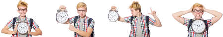 Young boy with alarm-clock in time management concept