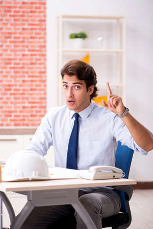 Construction supervisor working on blueprintsの写真素材