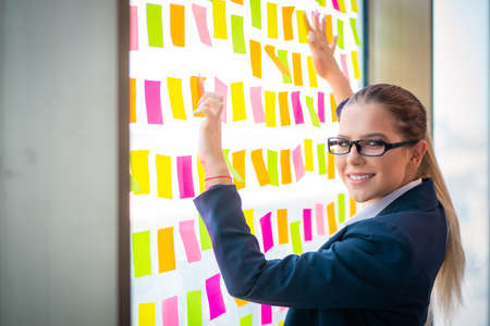 Beautiful female employee with many conflicting prioritiesの写真素材