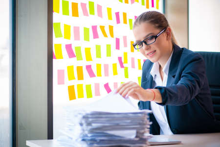Beautiful female employee with many conflicting priorities