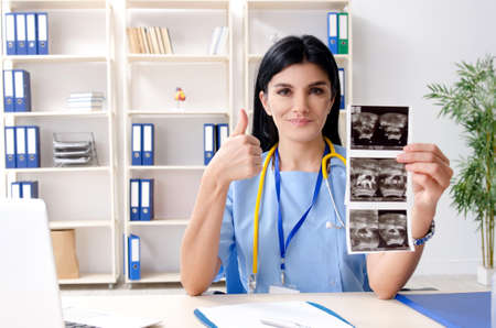 Female doctor gynecologist working in the clinicの写真素材
