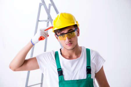 Young worker with protective equipment in safety concept