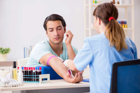 Young patient during blood test sampling procedureの写真素材