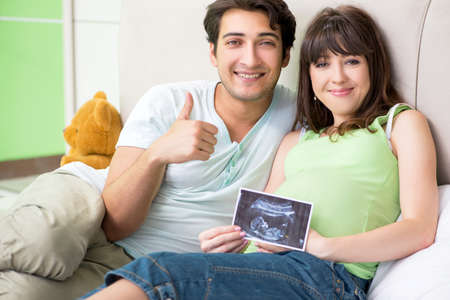 Young family finding out about pregnancyの写真素材