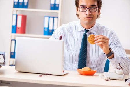 Employee eating food with cockroaches crawling aroundの写真素材