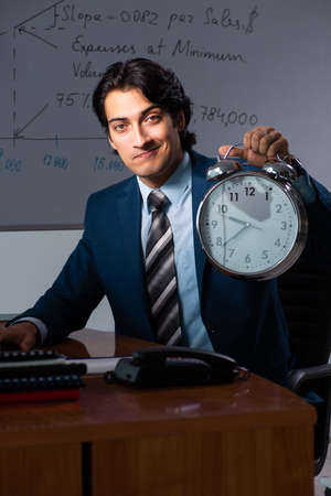 Financial specialist working late in the officeの写真素材