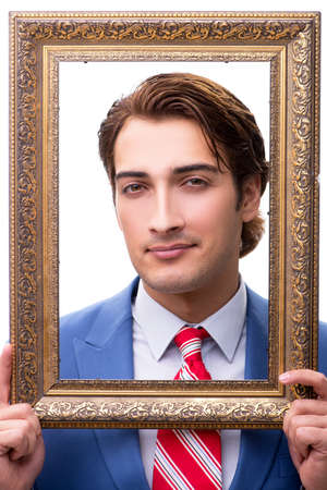 Elegant businessman with picture frame isolated on white
