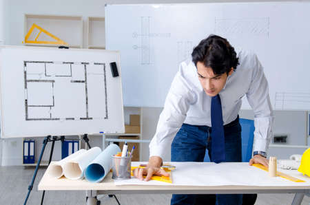 Young handsome architect working on the projectの写真素材