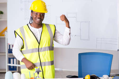 Young black architect working on project