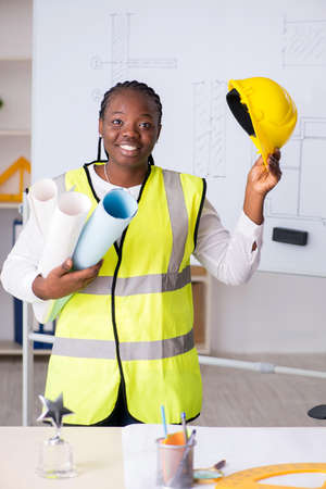 Young black architect working on project