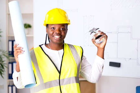 Young black architect working on project