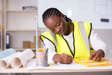 Young black architect working on projectの写真素材