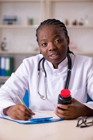 Black female doctor working at clinicの写真素材