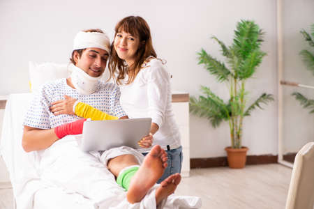Loving wife looking after injured husband