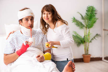 Loving wife looking after injured husband
