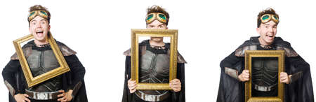 Young funny man in armour suitの写真素材