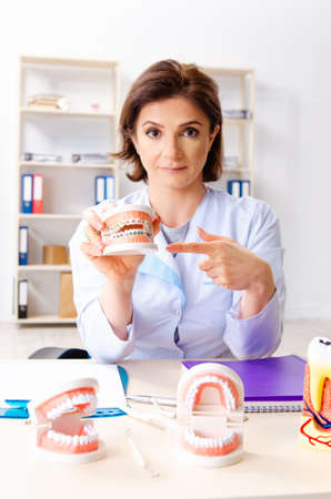 Female doctor working on new teeth implantの写真素材