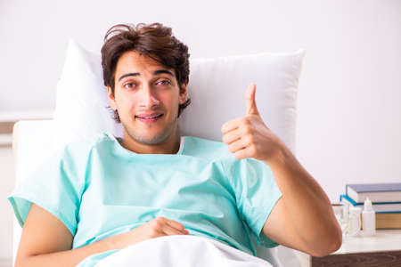 Young handsome man staying in hospitalの写真素材