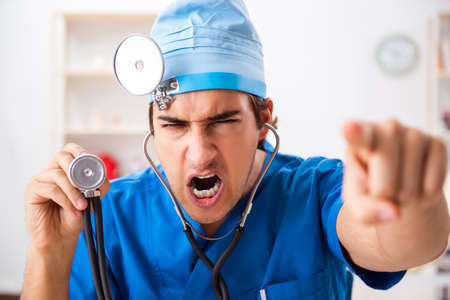 Mad doctor working in the clinicの写真素材