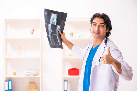 Young male doctor radiologist working at the clinicの写真素材