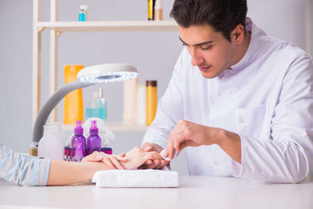 Hands during manicure care sessionの写真素材