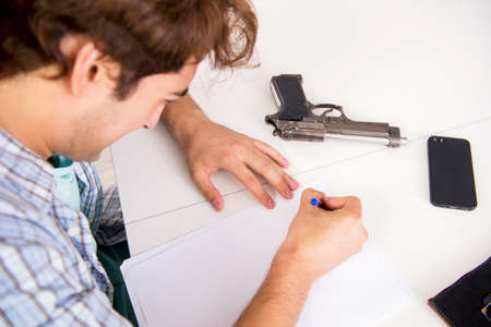 Young man in depression committing suicide