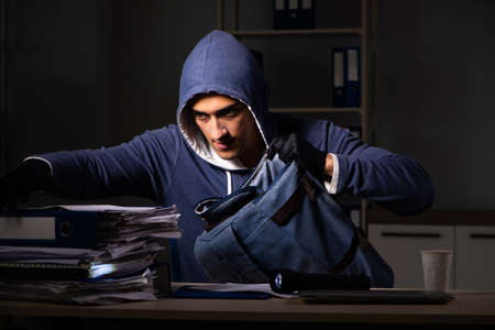 Thief trying to steal personal data in identity theft concept