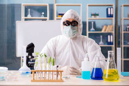 Male biotechnology scientist chemist working in the labの写真素材
