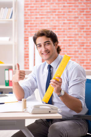 Construction supervisor working on blueprintsの写真素材