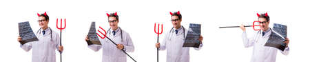 Devil doctor in funny medical concept isolated on white backgrouの写真素材